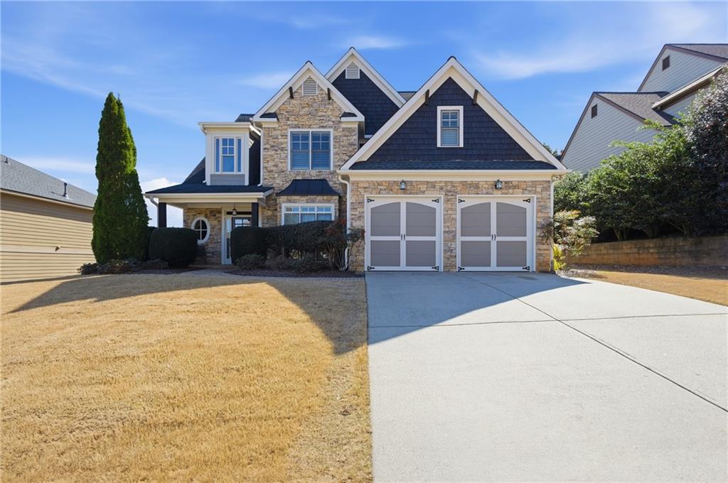 4340 Silent Path Cumming, GA 30028 - Photo 2 of 47 a front view of a house with a yard