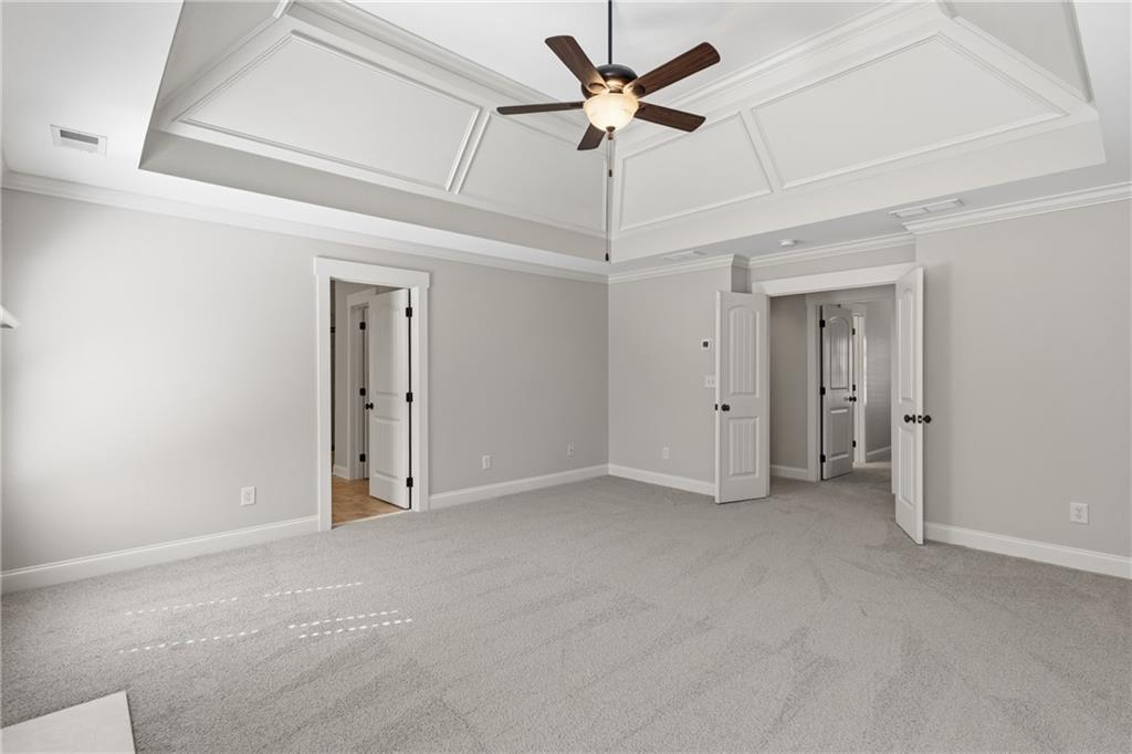 4340 Silent Path Cumming, GA 30028 - Photo 25 of 47 en empty room with fan and a ceiling fan