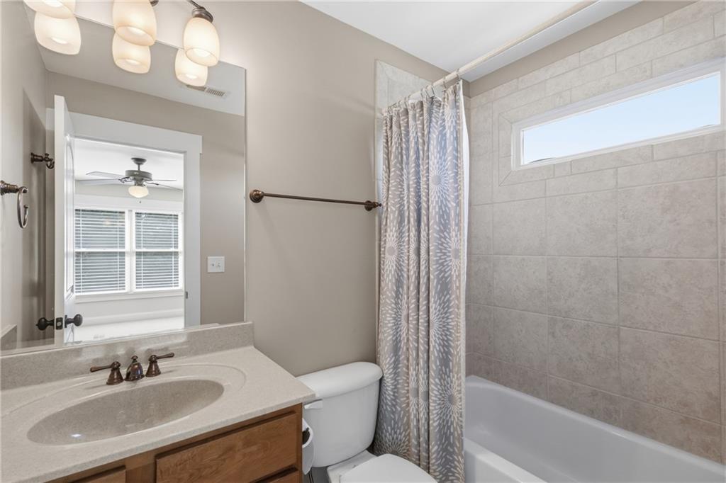 4340 Silent Path Cumming, GA 30028 - Photo 31 of 47 a bathroom with a sink toilet and shower