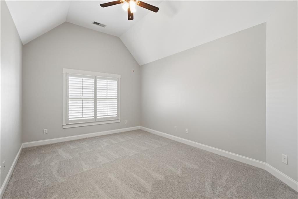 4340 Silent Path Cumming, GA 30028 - Photo 32 of 47 an empty room with a window and a ceiling fan