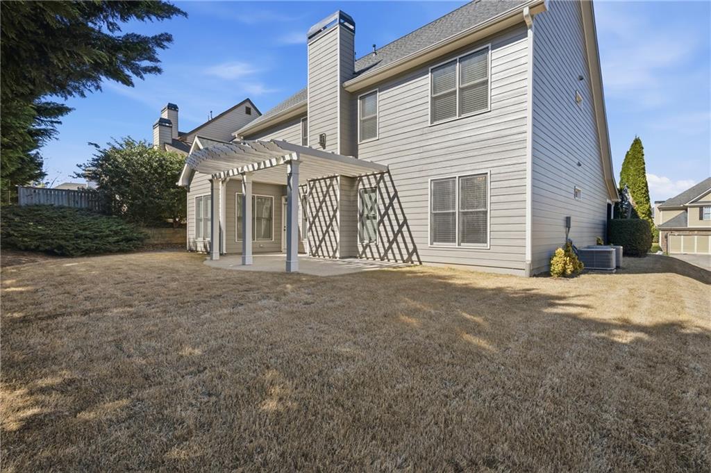 4340 Silent Path Cumming, GA 30028 - Photo 36 of 47 a front view of a house with a garage