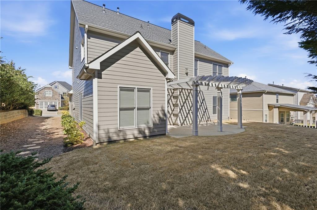4340 Silent Path Cumming, GA 30028 - Photo 38 of 47 a view of a house with a yard