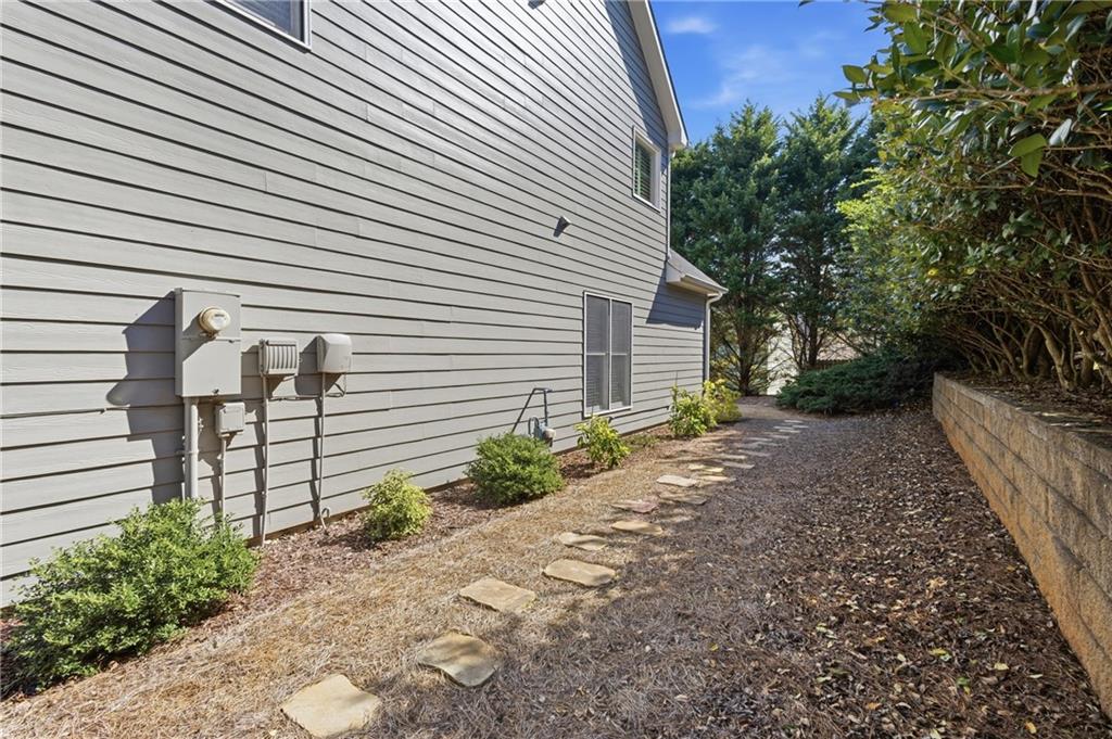 4340 Silent Path Cumming, GA 30028 - Photo 39 of 47 a pathway of a house with backyard and plants