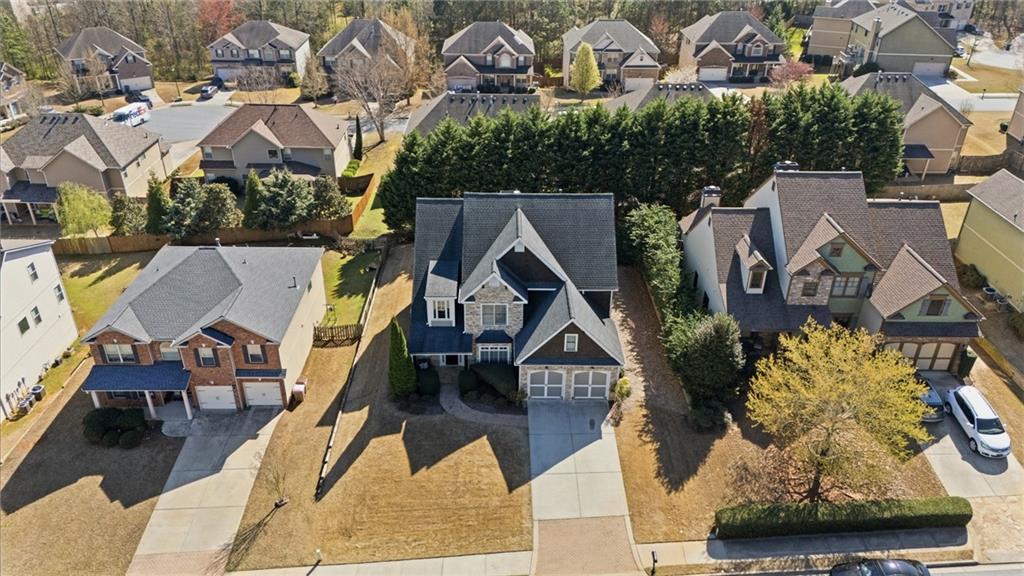 4340 Silent Path Cumming, GA 30028 - Photo 40 of 47 an aerial view of multiple houses with a yard