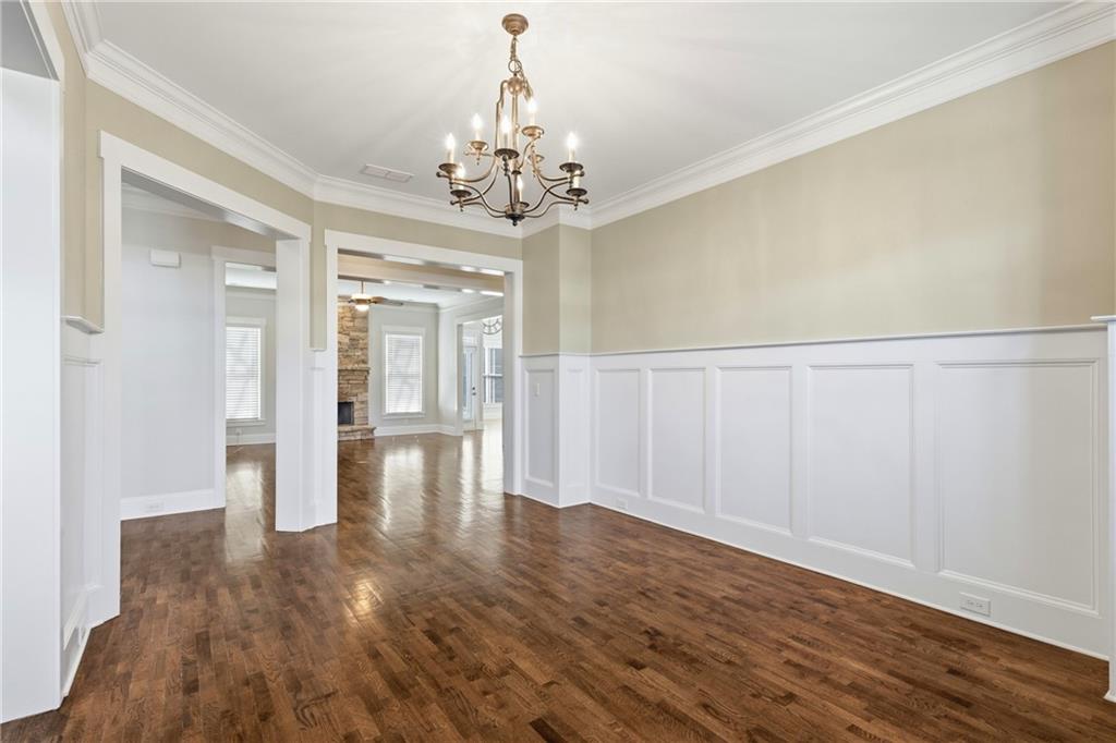 4340 Silent Path Cumming, GA 30028 - Photo 7 of 47 a view of an empty room with wooden floor
