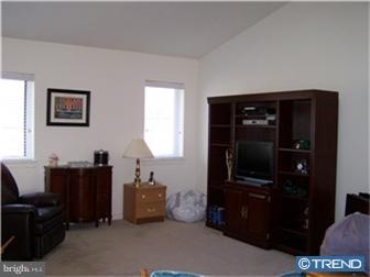 8007 Westview Road, Unit 7 Wilmington, DE 19802 - Photo 2 of 6 a living room with furniture and a flat screen tv