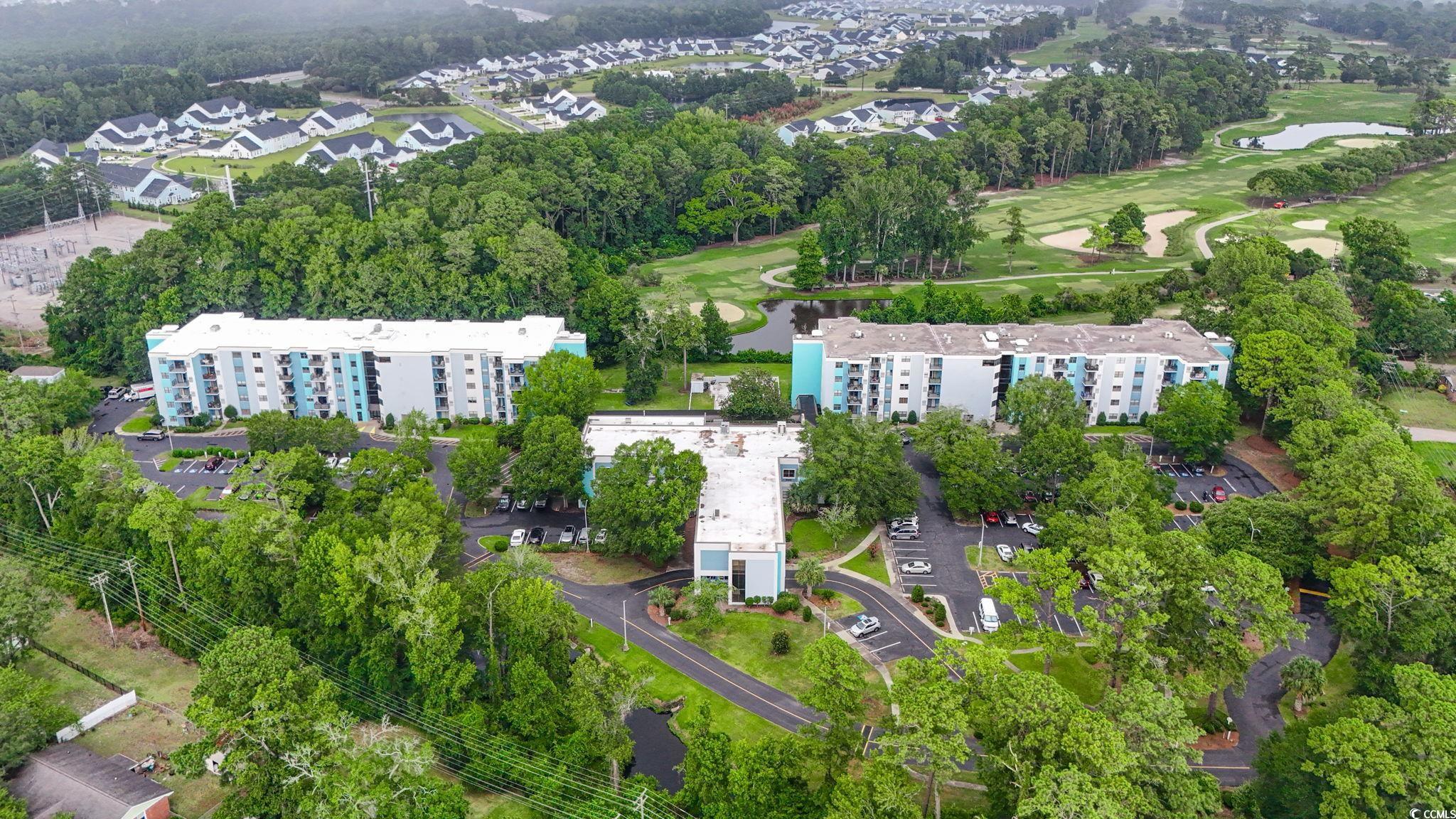 5001 Little River Road, Unit W106 Myrtle Beach, SC 29577 - Photo 19 of 28 Community pool featuring a patio area and a fenced backyard