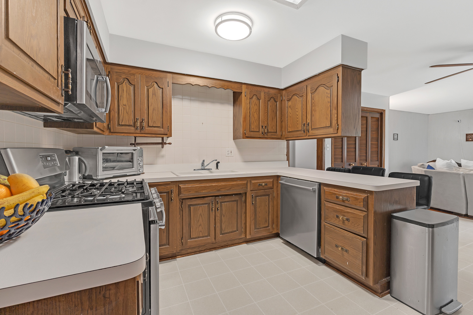 11020 Raleigh Street Westchester, IL 60154 - Photo 10 of 27 a kitchen with stainless steel appliances granite countertop a stove sink and cabinets