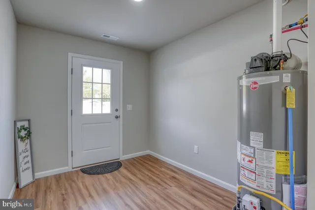 a view of room with window and wooden floor