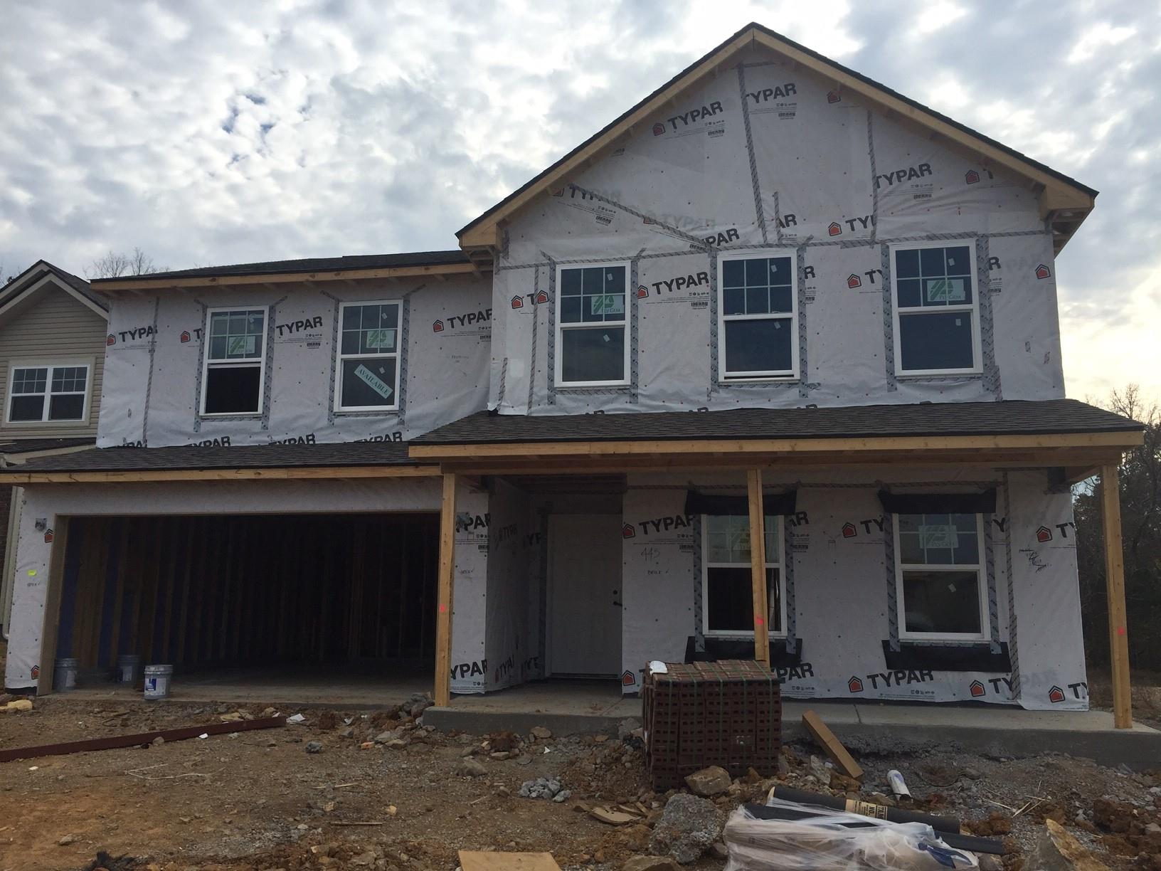 1406 Old Stone Road, Unit 443 Lebanon, TN 37087 - Photo 1 of 24 a front view of a house with a yard