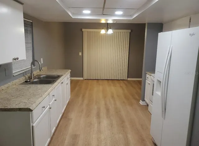 a bathroom with a double vanity sink and mirror