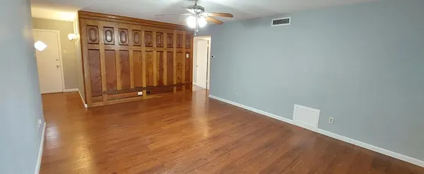 a view of a livingroom with wooden floor