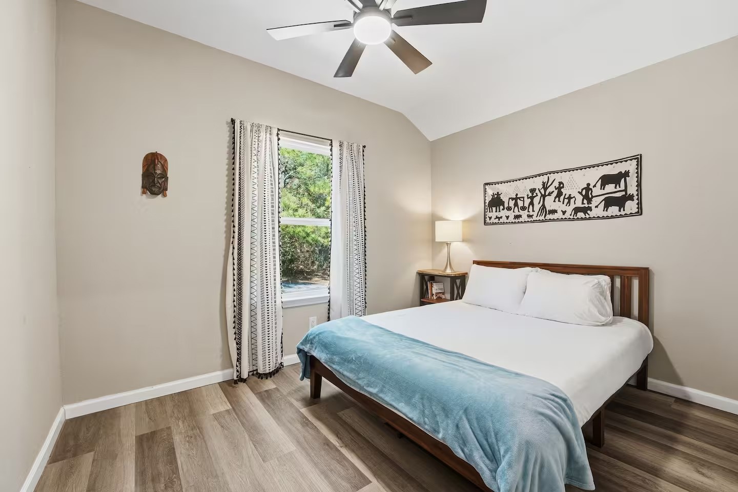 201 Winfield Thicket Road Bastrop, TX 78602 - Photo 24 of 36 a bedroom with a large bed and a window
