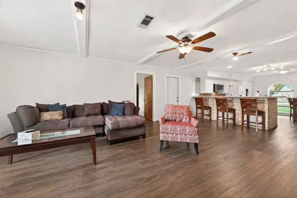 a view of a dining room with furniture and a window