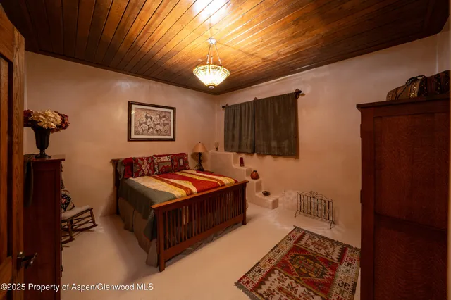 a balcony with furniture and a potted plant