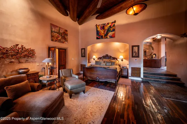 a view of a bedroom with a bed and a window