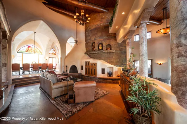 a view of a forest with mountains in the background