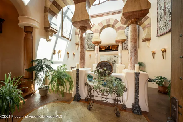 a view of a lush green forest with lots of trees