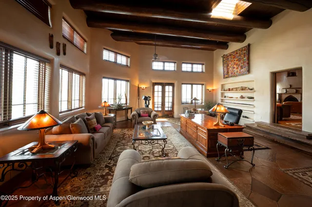 a big yard with lots of green space and deers