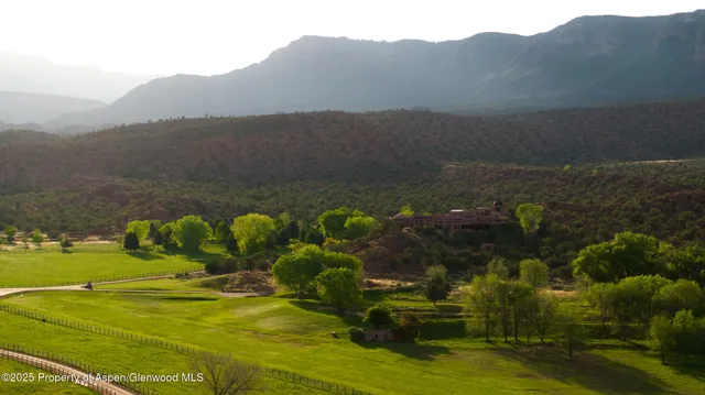 a view of a town with mountains in the background