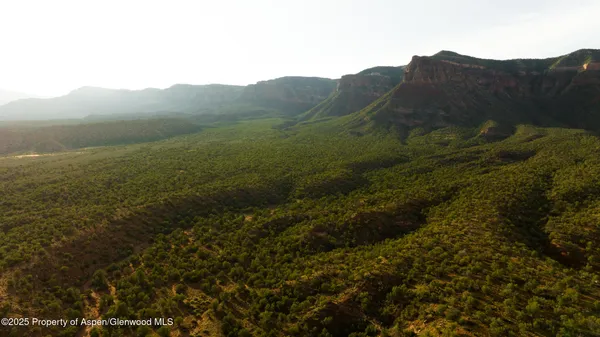 a view of a town with mountains in the background