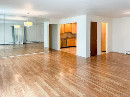 a view of an empty room with glass door