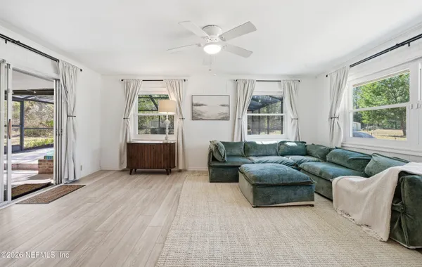 a living room with furniture and a large window