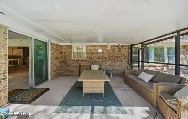 a view of a backyard with sitting area