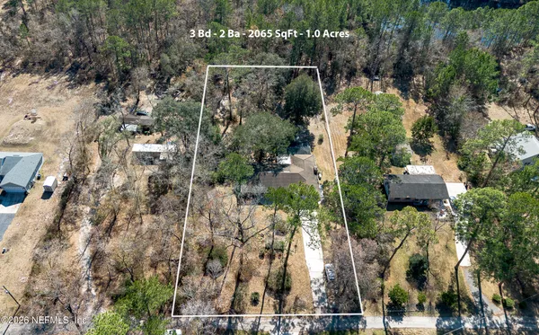an aerial view of residential house with outdoor space