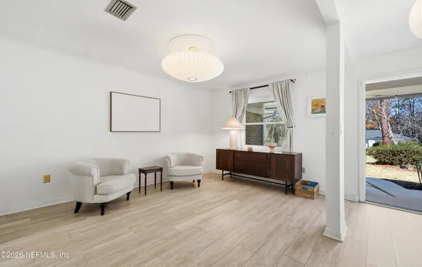 a living room with furniture and a window