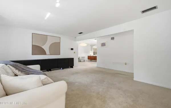 a living room with furniture and a couch