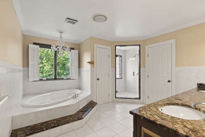 343 Bay Road Hamilton, MA 01982 - Photo 23 of 34 a spacious bathroom with a granite countertop tub shower and window