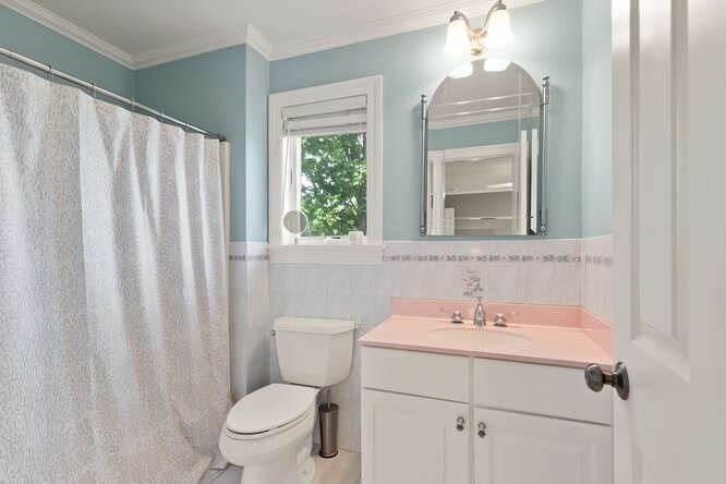 343 Bay Road Hamilton, MA 01982 - Photo 27 of 34 a bathroom with a toilet a sink and a mirror