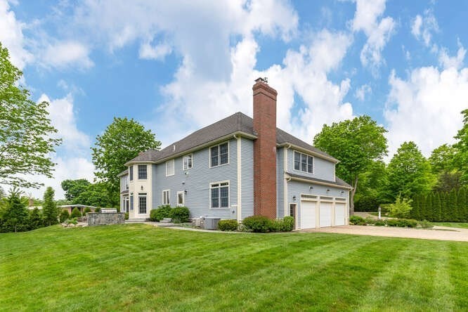 343 Bay Road Hamilton, MA 01982 - Photo 4 of 34 a front view of a house with a garden