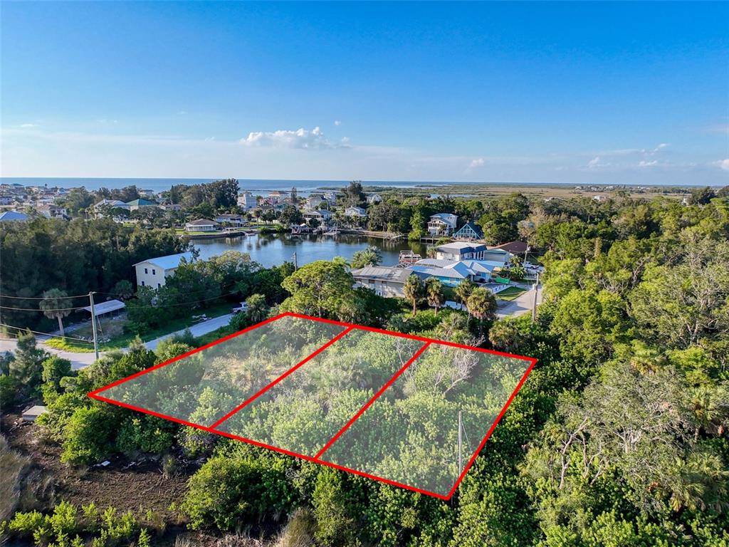 12 Nowiki Avenue Hudson, FL 34667 - Photo 9 of 20 an aerial view of a tennis ground and a terrace