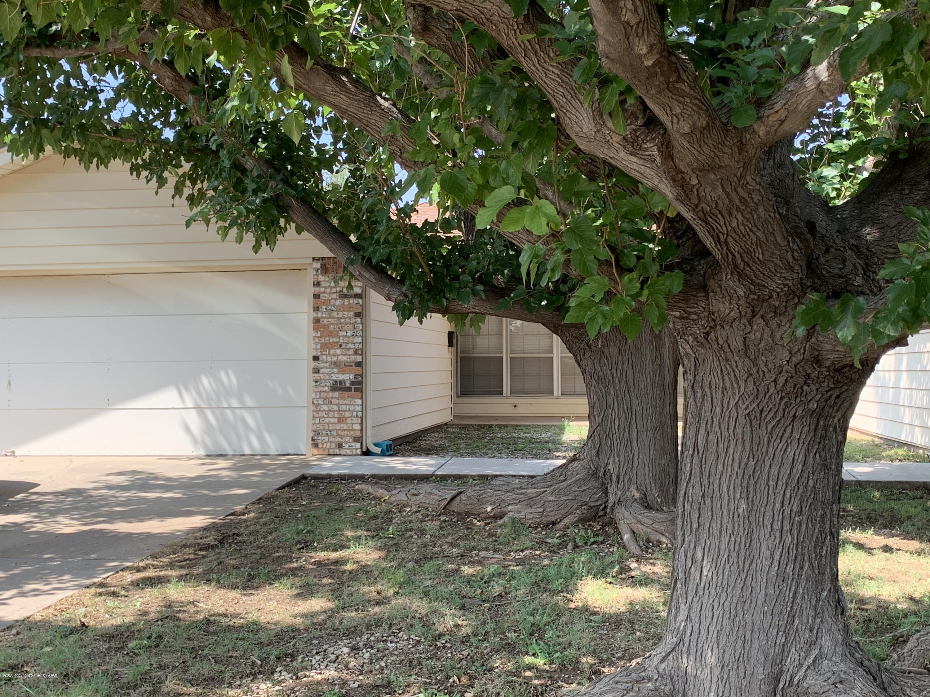 4406 Ridgecrest Circle Amarillo, TX 79109 - Photo 1 of 12 a view of a yard in front of a house with large tree