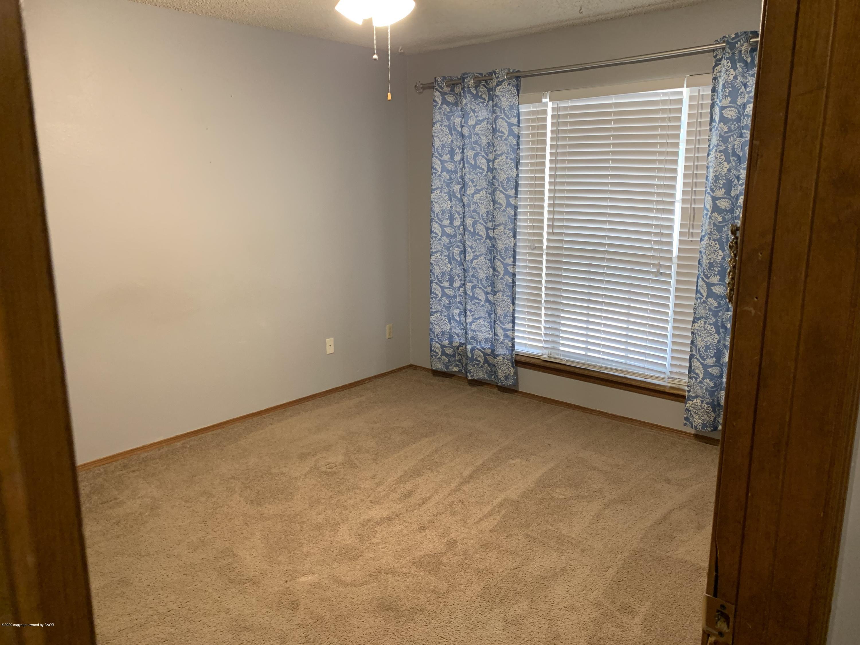 4406 Ridgecrest Circle Amarillo, TX 79109 - Photo 7 of 12 a view of an empty room with a window
