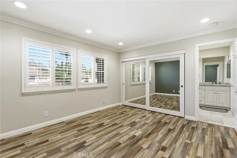 a view of wooden floor and windows in a room