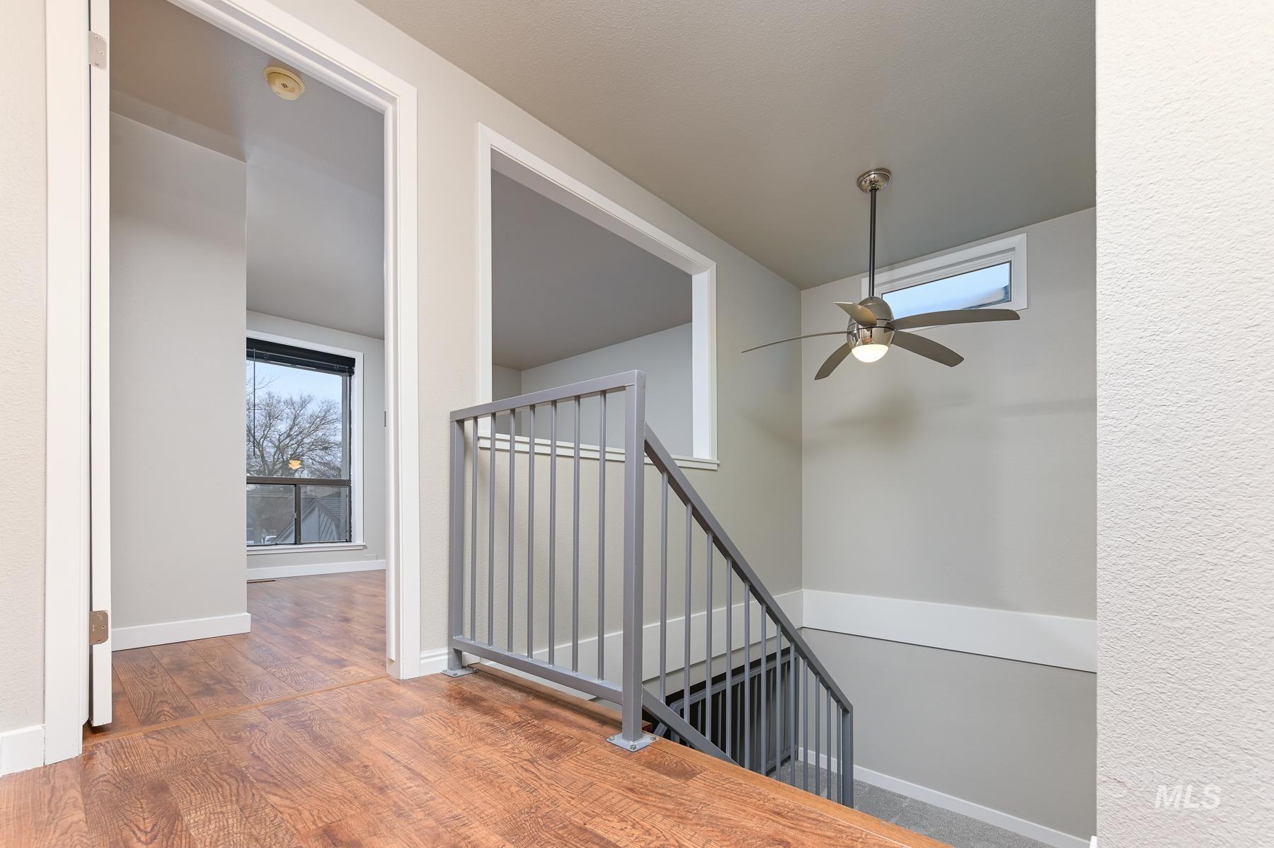 7208 West Cascade Street Boise, ID 83704 - Photo 20 of 49 Staircase with ceiling fan and wood finished floors