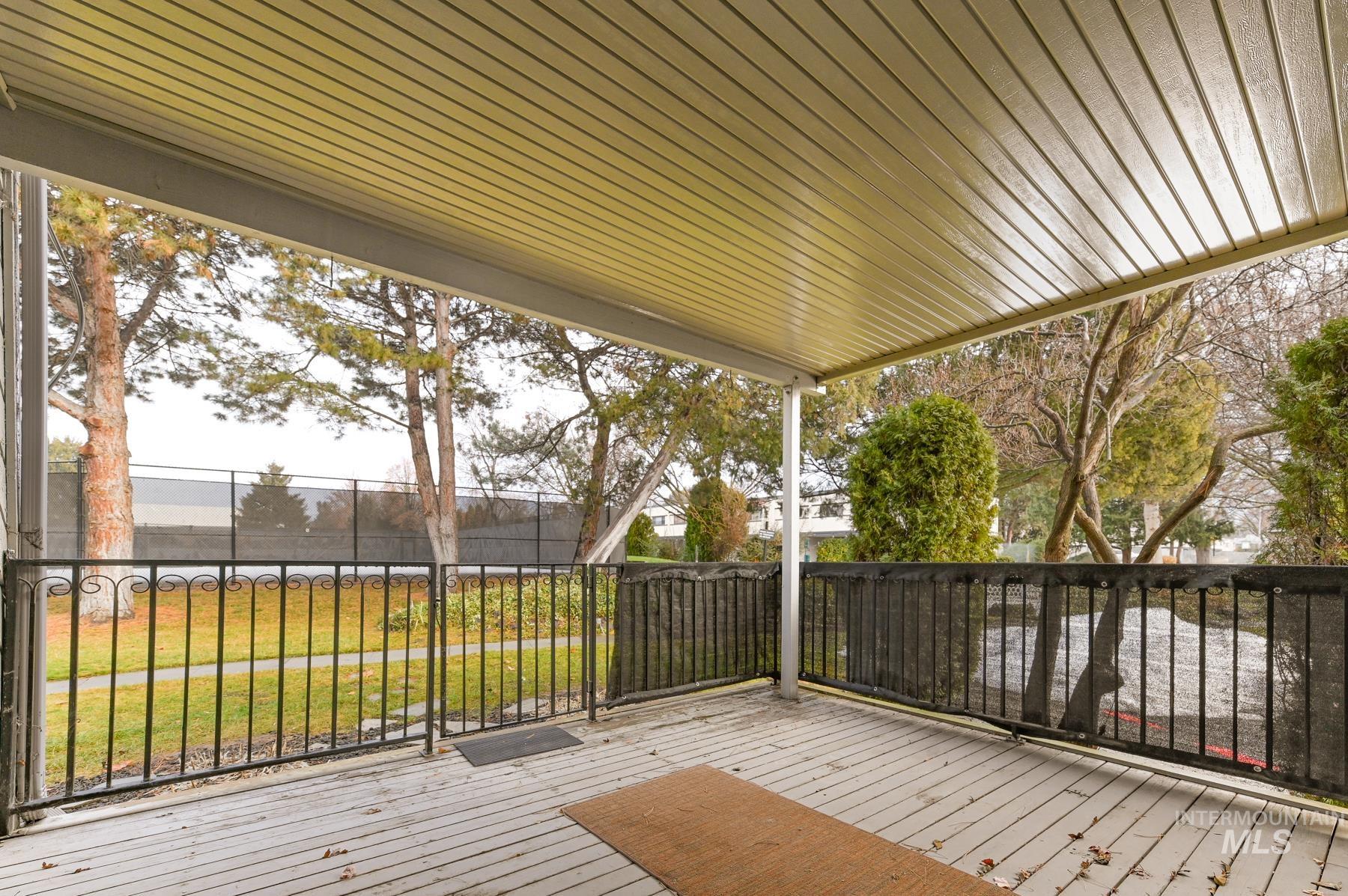 7208 West Cascade Street Boise, ID 83704 - Photo 41 of 49 Wooden deck featuring a lawn
