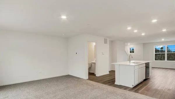a kitchen with stainless steel appliances granite countertop a stove and a sink