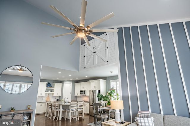 a spacious bathroom with a granite countertop sink and a mirror