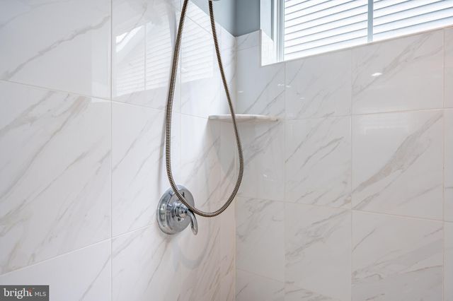 a front view of a house with a yard porch and sitting area