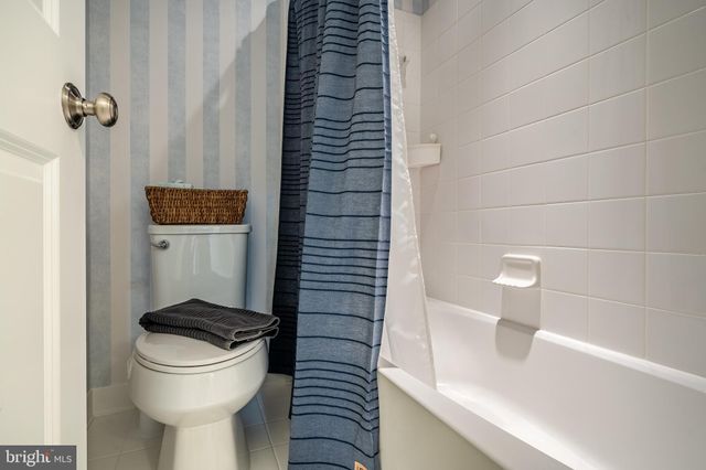 an aerial view of a house with a lake view