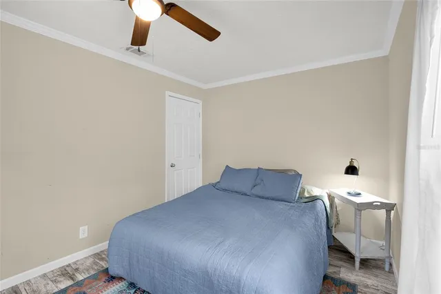 a bedroom with a bed and chair