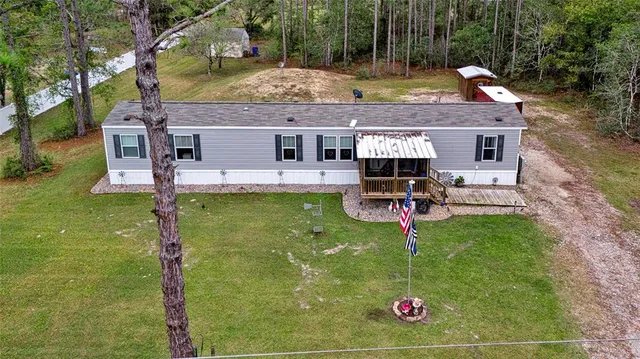 a view of swimming pool with sitting area