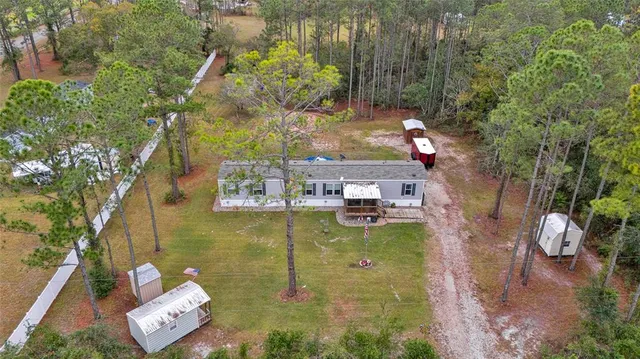a aerial view of a house with swimming pool