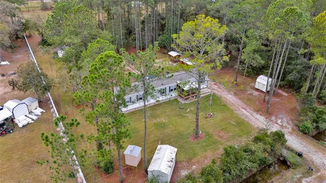 an aerial view of a house with outdoor space