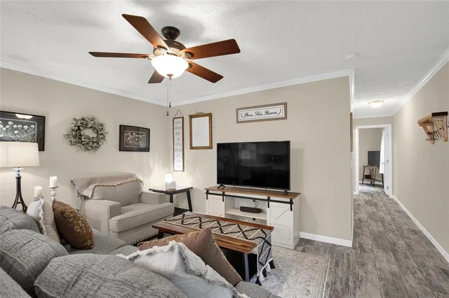 a living room with furniture and a flat screen tv