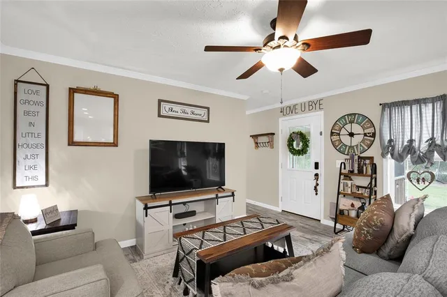 a living room with furniture and a flat screen tv